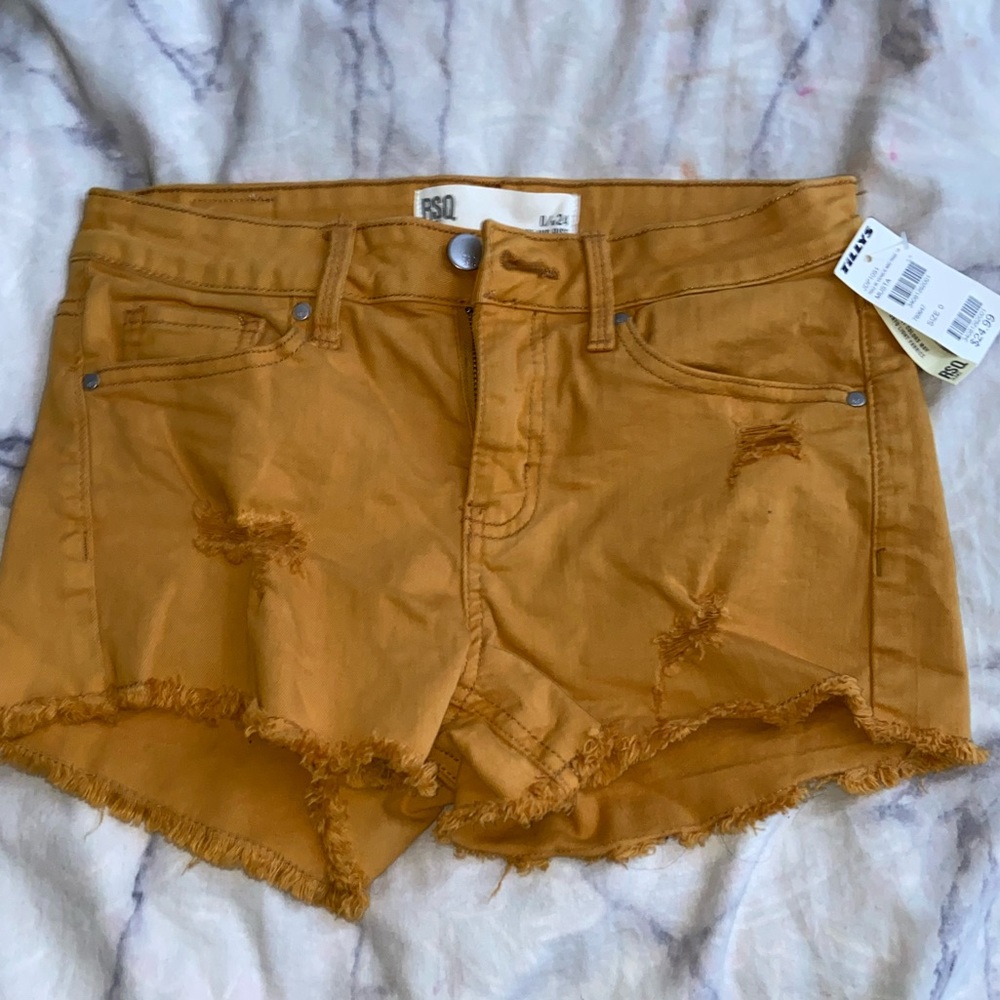 Tilly’s Tan Ripped Jean Shorts